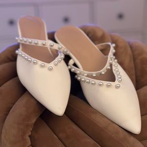 White flats with pearls